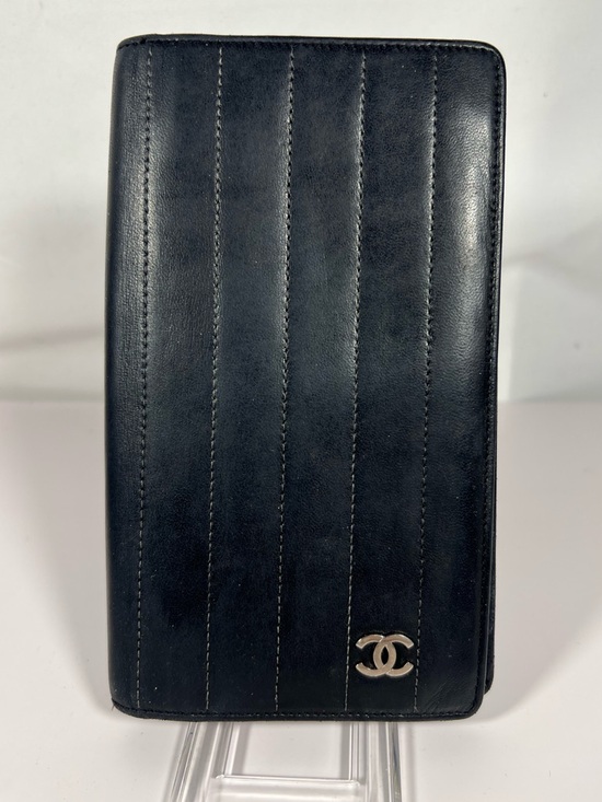 CHANEL Handbags - 1124: Chanel Vertical Quilted Leather Wallet CC Logo Black